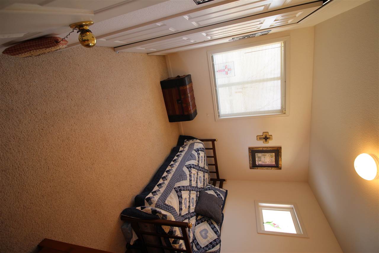 3455 F Road Clifton, CO 81520 - Photo 19 of 29 a bathroom with a window a sink and a mirror