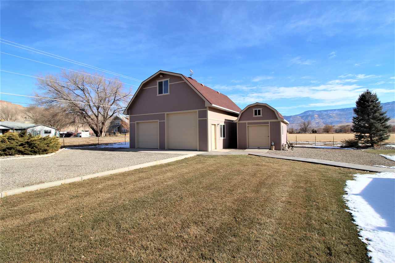3455 F Road Clifton, CO 81520 - Photo 2 of 29 a front view of a house with a yard
