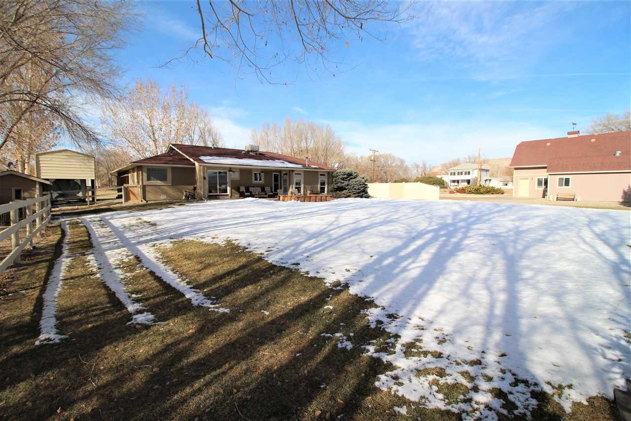 3455 F Road Clifton, CO 81520 - Photo 22 of 29 a view of a house with a yard