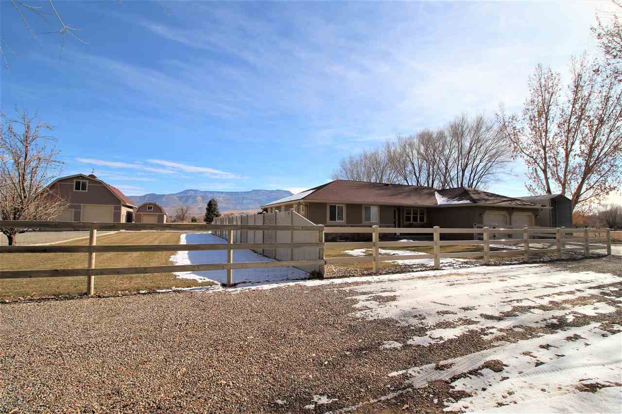 3455 F Road Clifton, CO 81520 - Photo 4 of 29 a view of a large house with a yard
