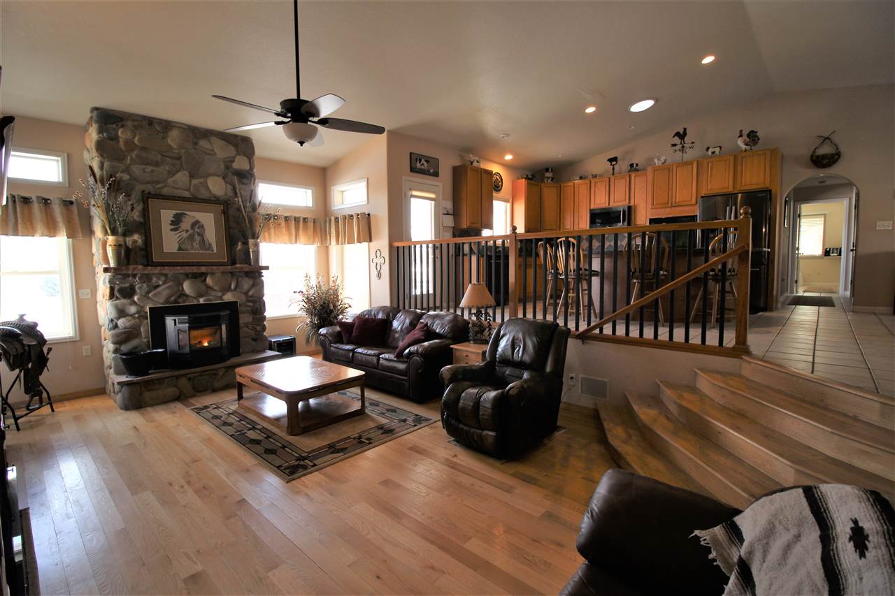 3455 F Road Clifton, CO 81520 - Photo 10 of 29 a living room with furniture fireplace and a flat screen tv