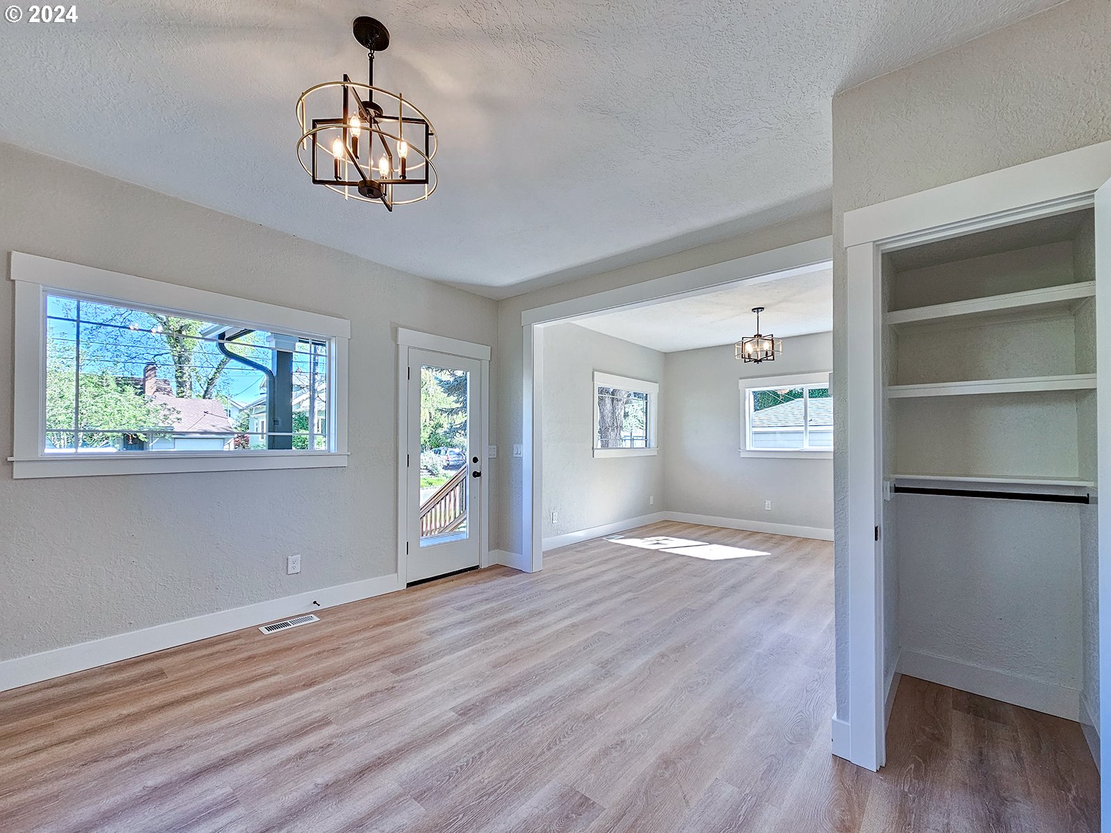 1532 Northeast Morgan Street Portland, OR 97211 - Photo 11 of 35 a view of empty room with wooden floor and window