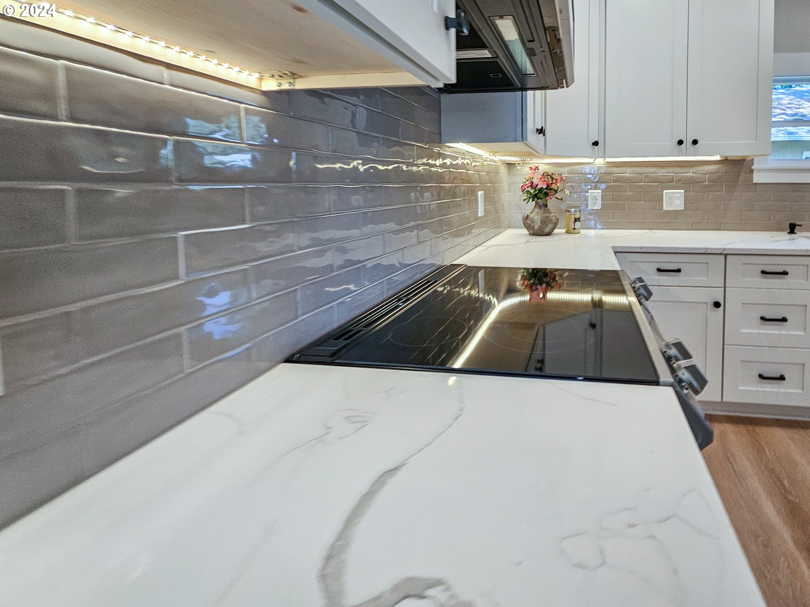 1532 Northeast Morgan Street Portland, OR 97211 - Photo 17 of 35 a kitchen with a stove and white cabinets