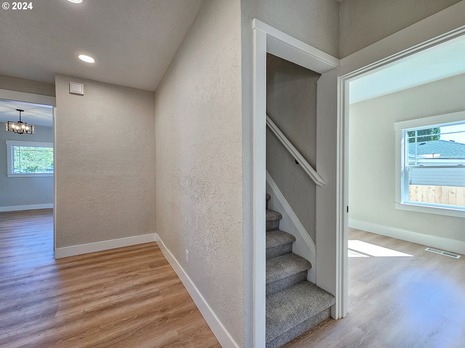 1532 Northeast Morgan Street Portland, OR 97211 - Photo 20 of 35 wooden floor in an empty room with a window