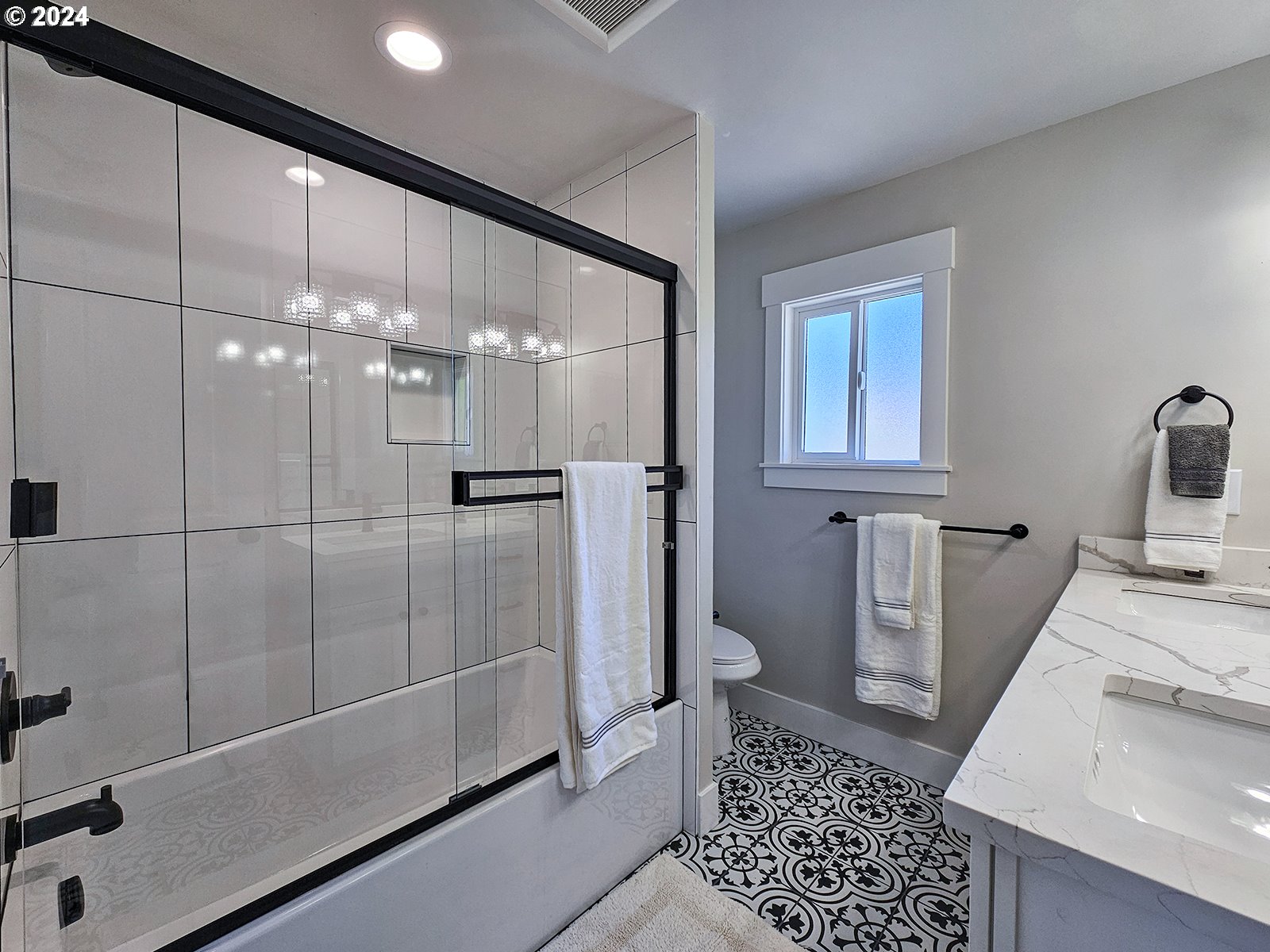 1532 Northeast Morgan Street Portland, OR 97211 - Photo 23 of 35 a bathroom with a sink a toilet and shower