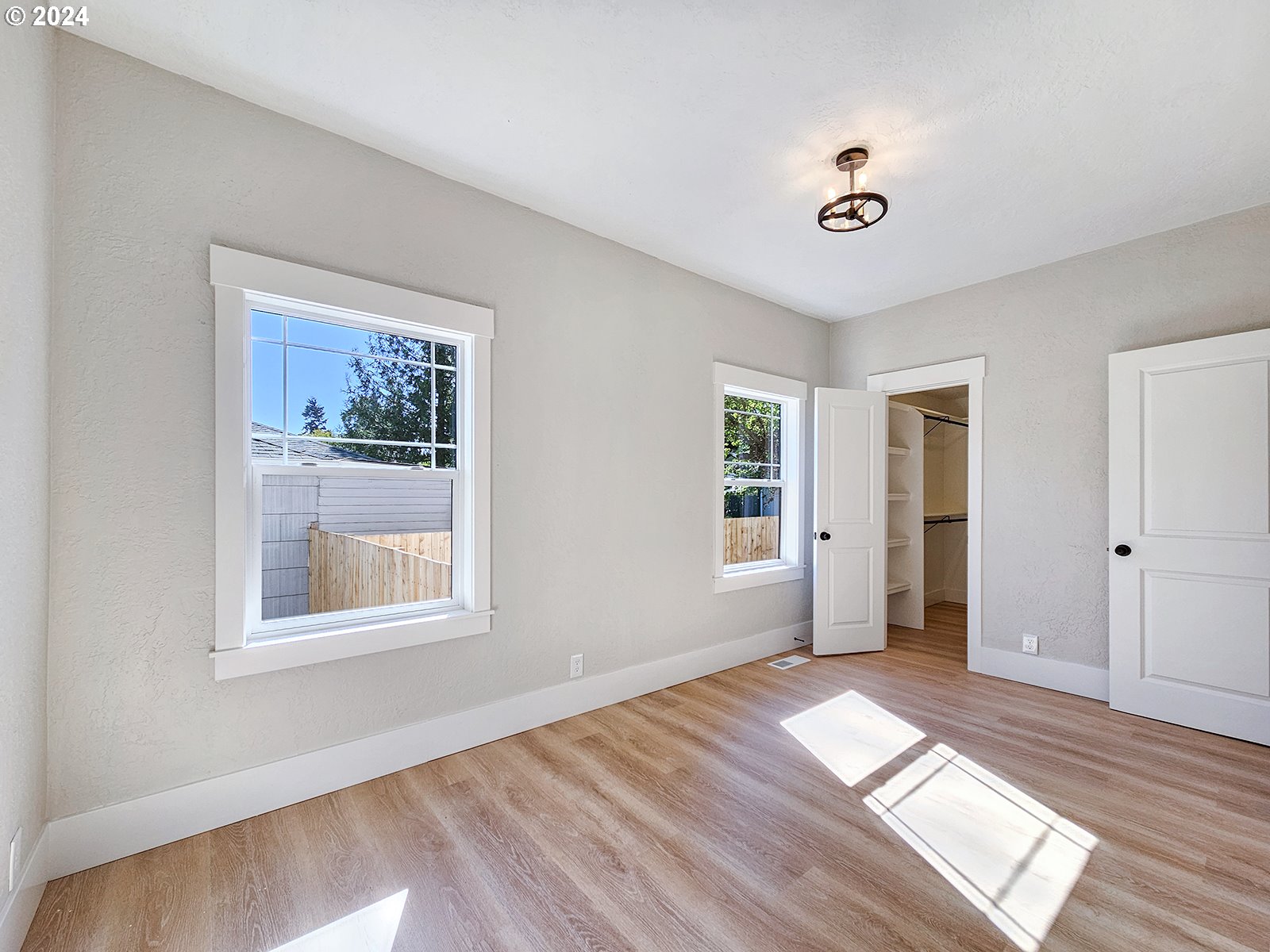 1532 Northeast Morgan Street Portland, OR 97211 - Photo 24 of 35 a view of empty room with wooden floor and fan