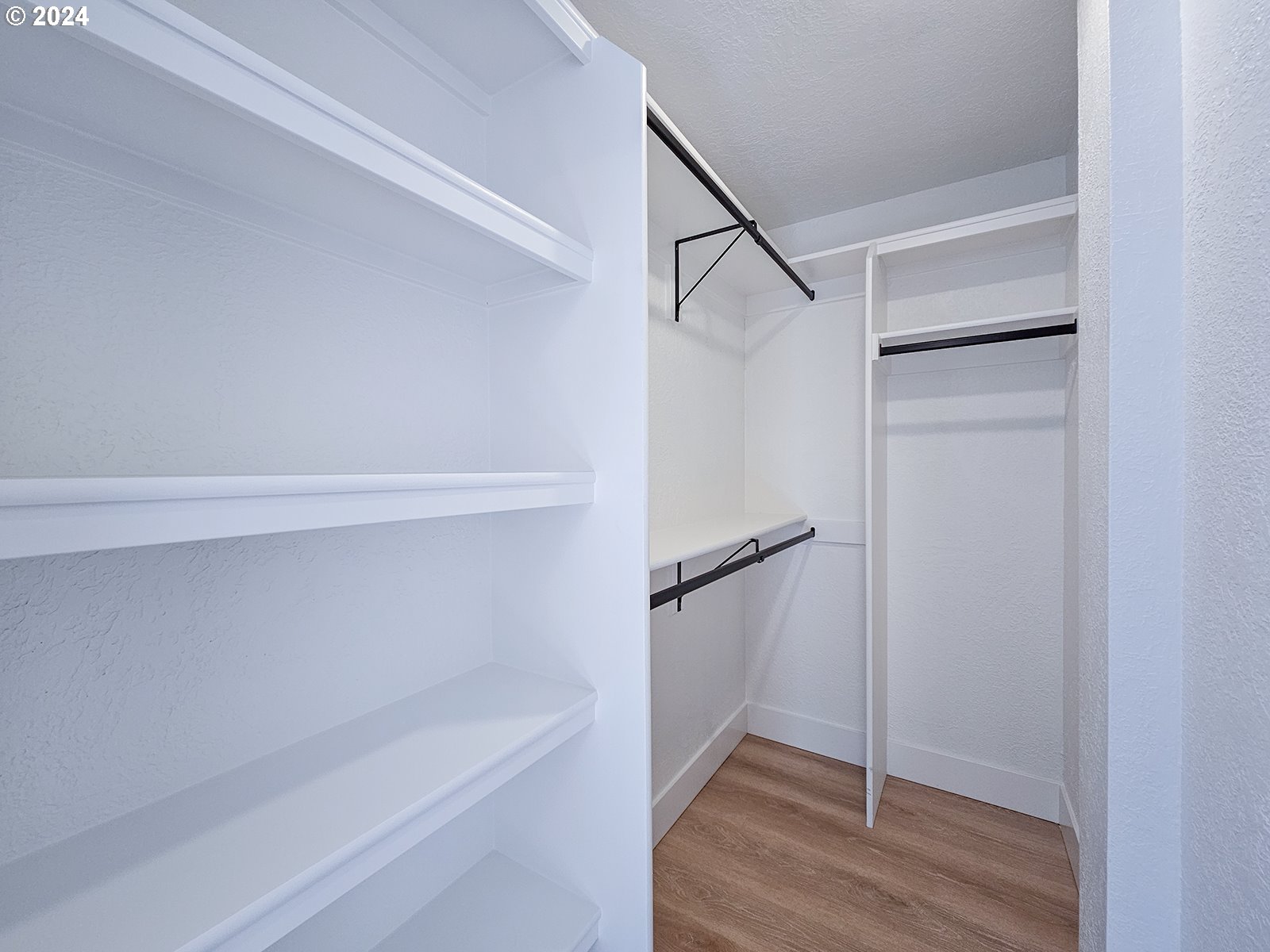 1532 Northeast Morgan Street Portland, OR 97211 - Photo 25 of 35 a view of walk in closet with empty racks