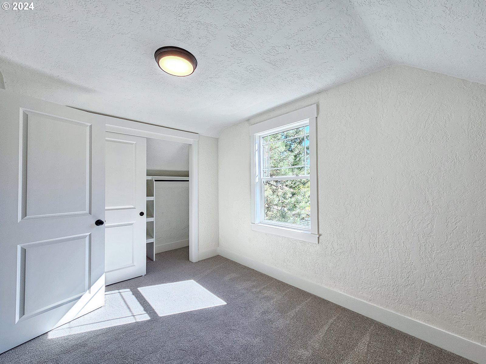 1532 Northeast Morgan Street Portland, OR 97211 - Photo 28 of 35 a view of an empty room with a window and wooden floor