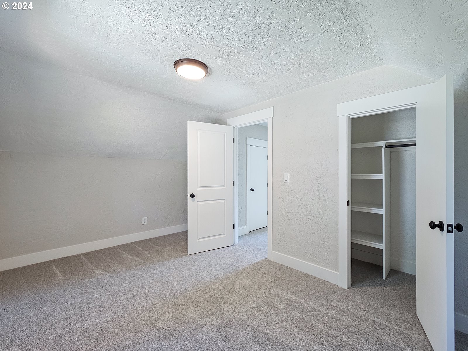 1532 Northeast Morgan Street Portland, OR 97211 - Photo 30 of 35 an empty room with closet and a window