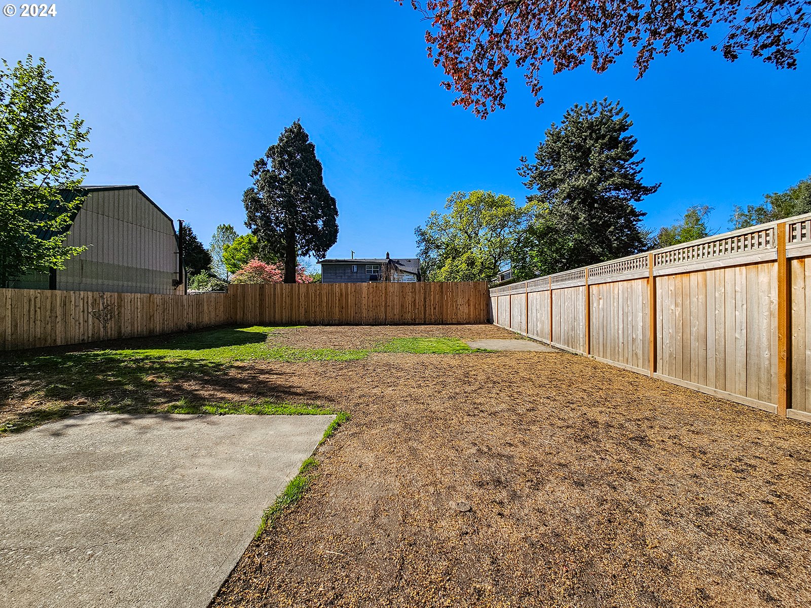 1532 Northeast Morgan Street Portland, OR 97211 - Photo 35 of 35 a view of a backyard with wooden fence