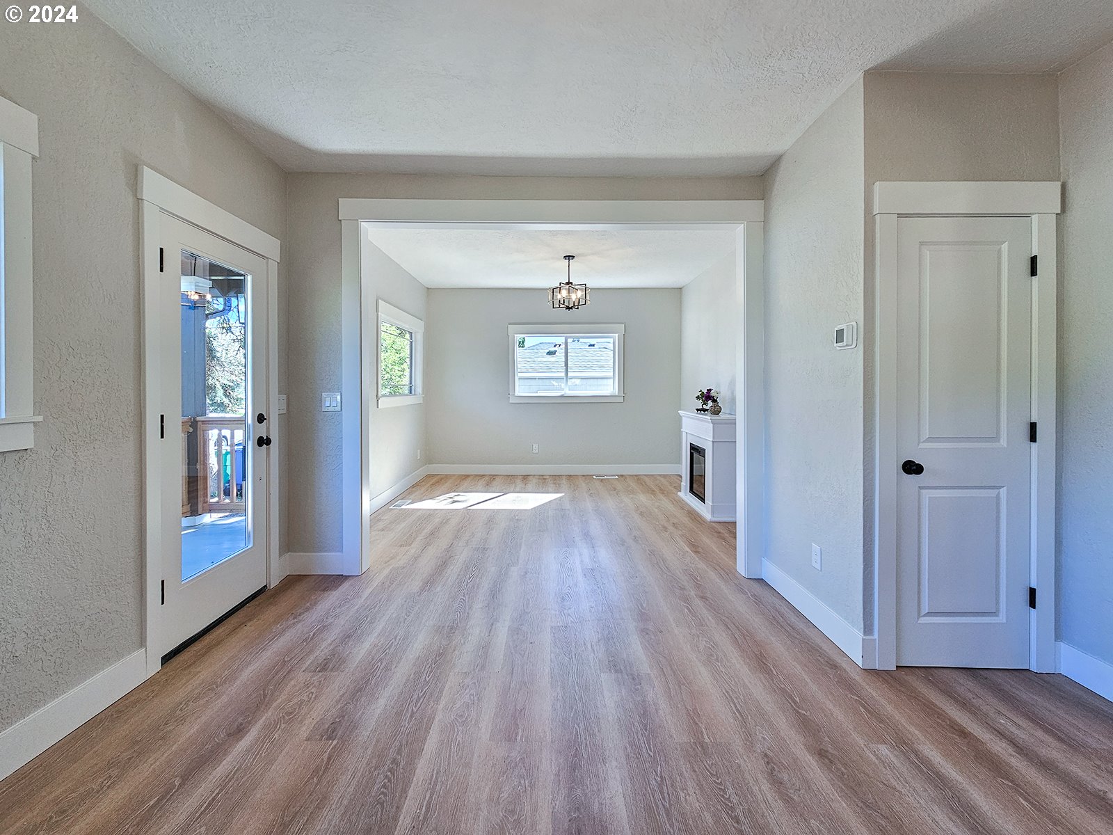 1532 Northeast Morgan Street Portland, OR 97211 - Photo 9 of 35 wooden floor in an empty room with a window