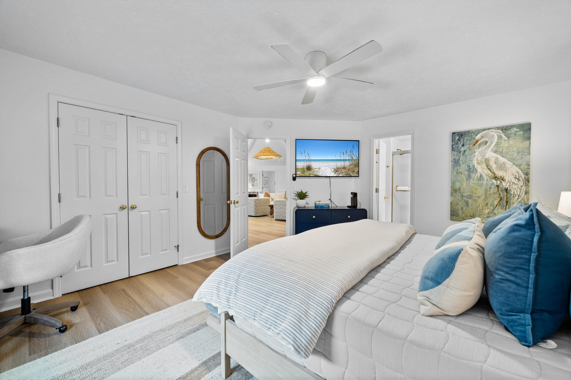 169 Pompano Street Inlet Beach, FL 32461 - Photo 32 of 91 a spacious bedroom with a bed a table and painting on the wall