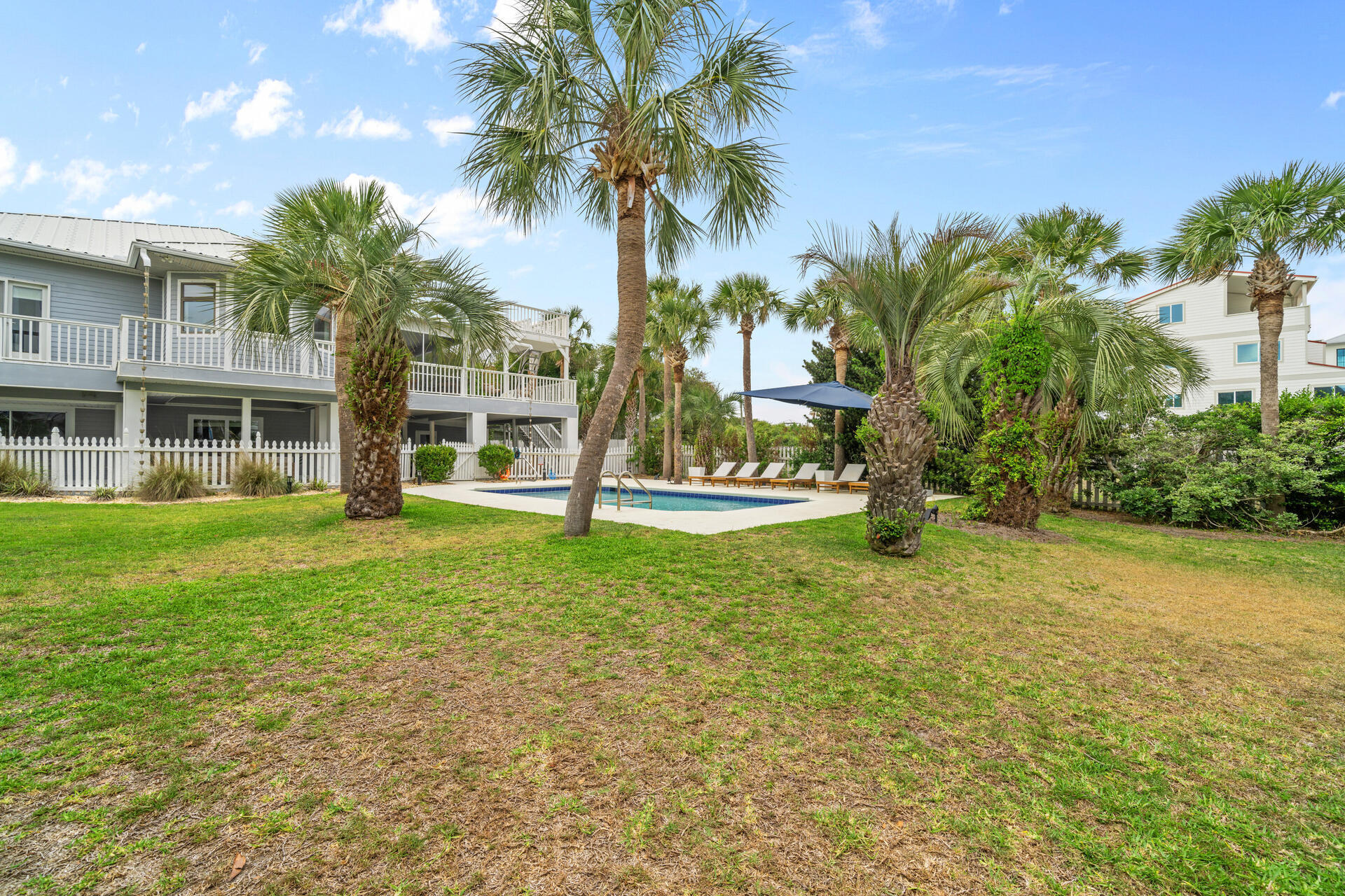 169 Pompano Street Inlet Beach, FL 32461 - Photo 66 of 91 a view of a house with a yard and palm trees