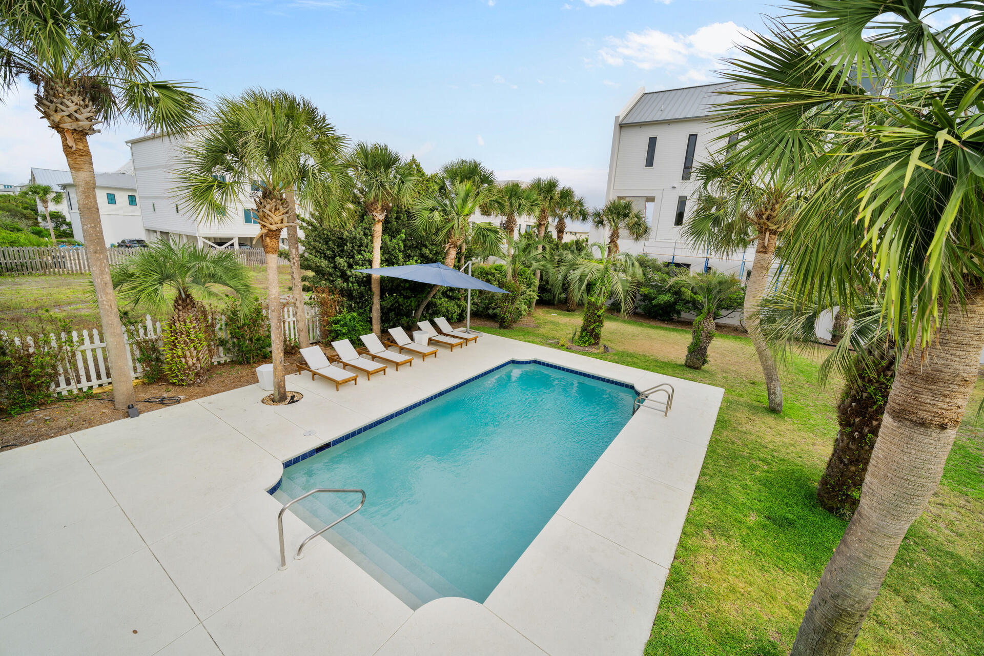 169 Pompano Street Inlet Beach, FL 32461 - Photo 68 of 91 a view of a swimming pool with a patio and a yard