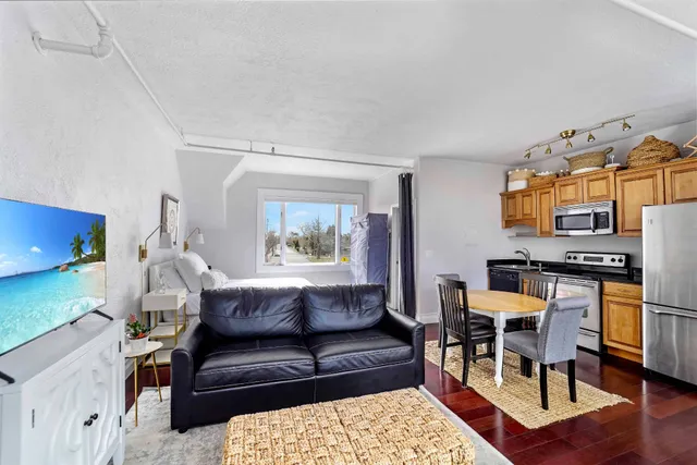 a living room with furniture and a table