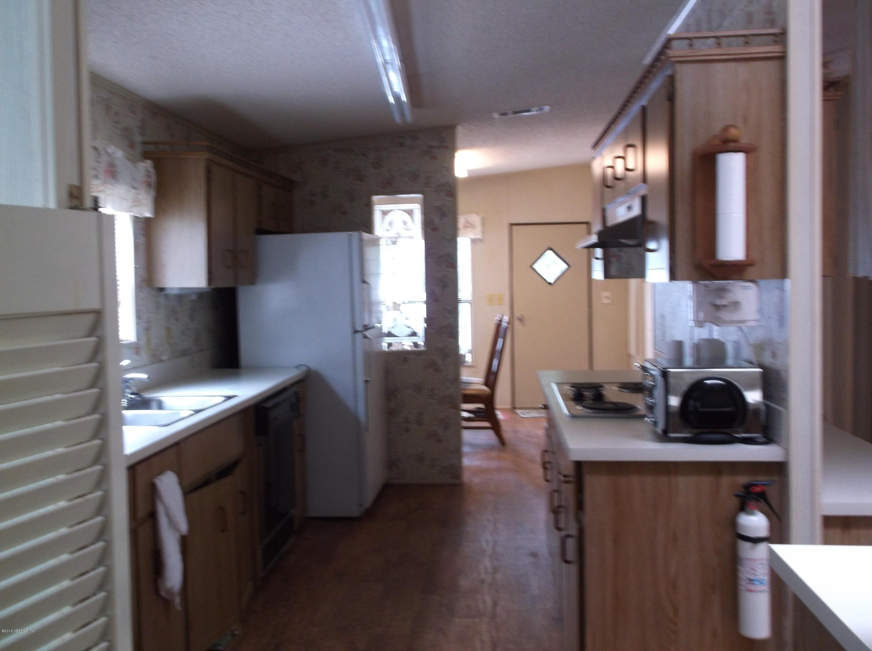 113 Keuka Road Interlachen, FL 32148 - Photo 7 of 31 kitchen from living room