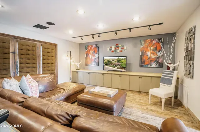 a living room with furniture and a large window