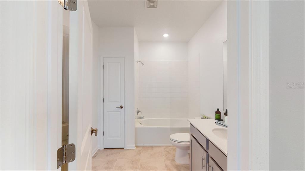 778 Rivington Avenue DeBary, FL 32713 - Photo 4 of 13 a bathroom with a bathtub a toilet and a shower