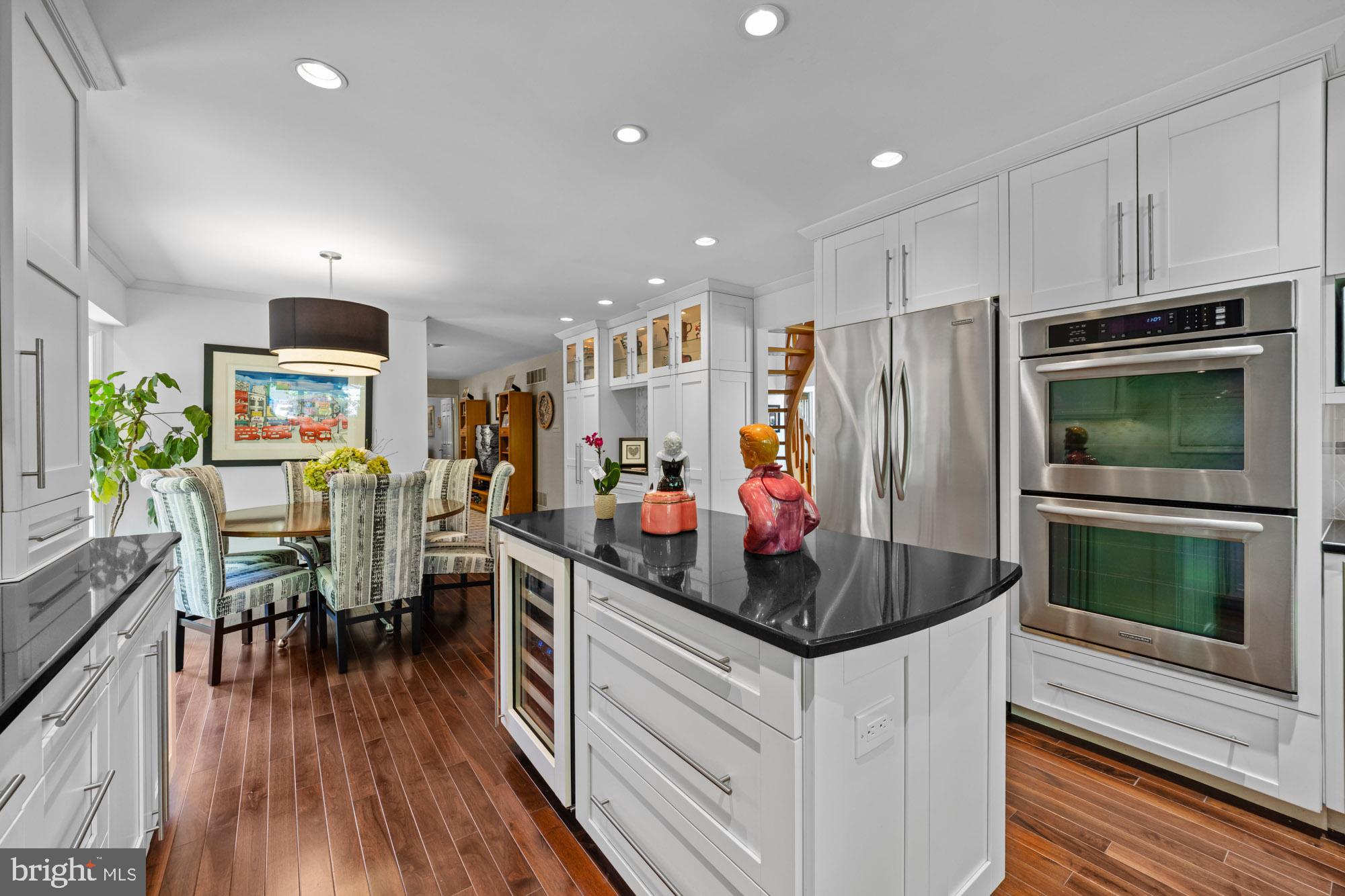 503 Birch Drive Cherry Hill, NJ 08003 - Photo 13 of 51 a kitchen with stainless steel appliances a stove a refrigerator a microwave a dining table and chairs