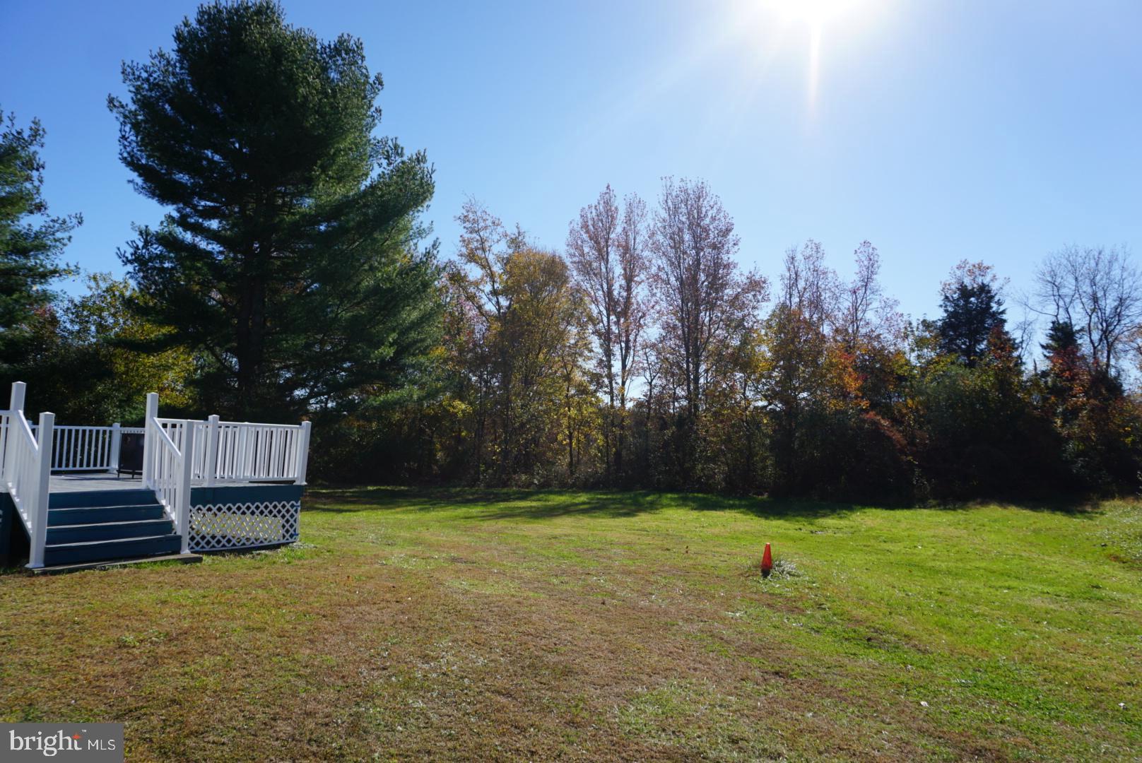 642 Stow Creek Road Bridgeton, NJ 08302 - Photo 23 of 25 a view of a backyard with wooden fence