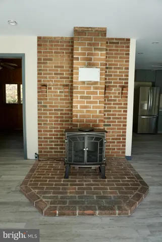 a view of an empty room with glass door