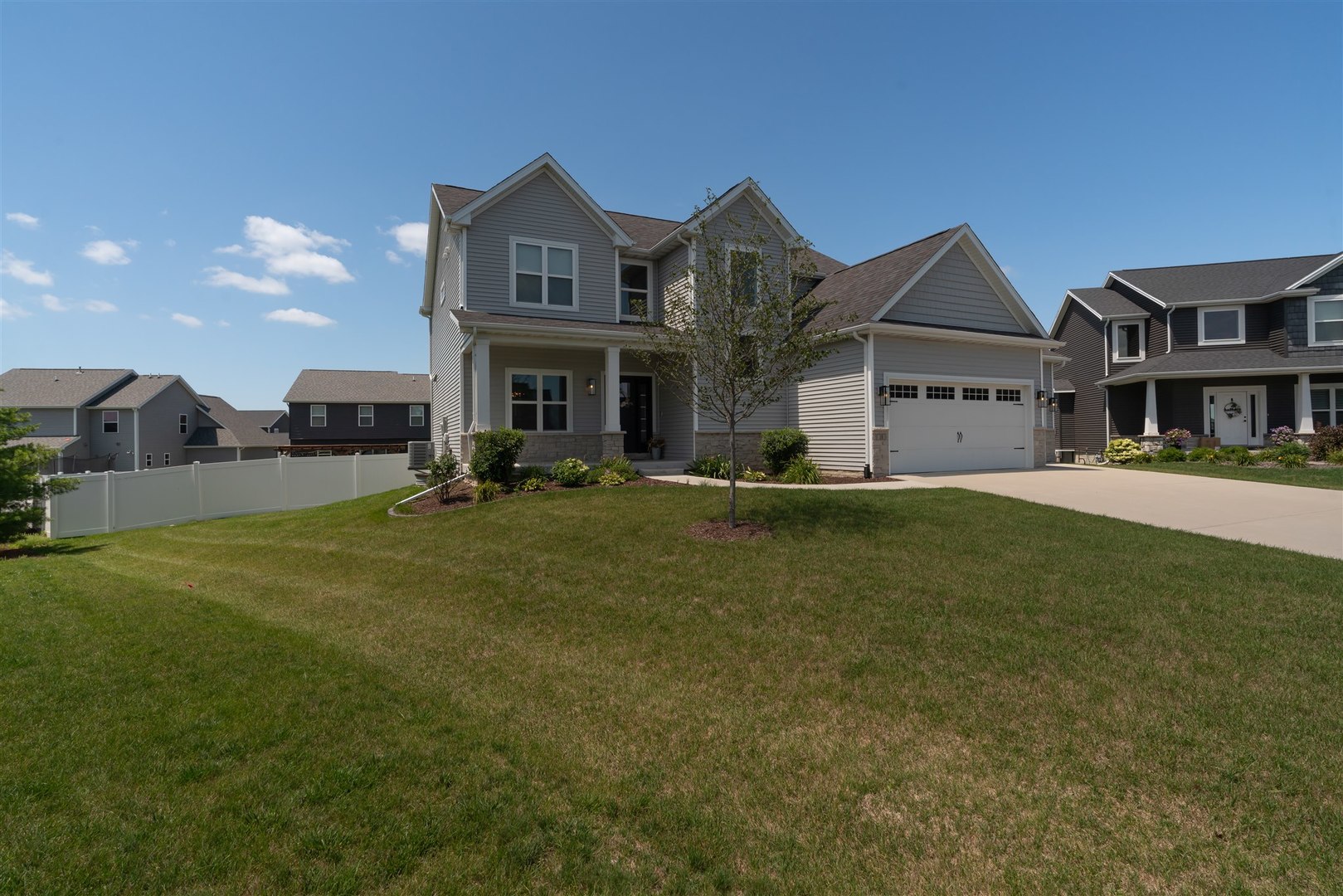 18 Red Maple Court Bloomington, IL 61705 - Photo 2 of 48 a view of a big house with a big yard and large trees