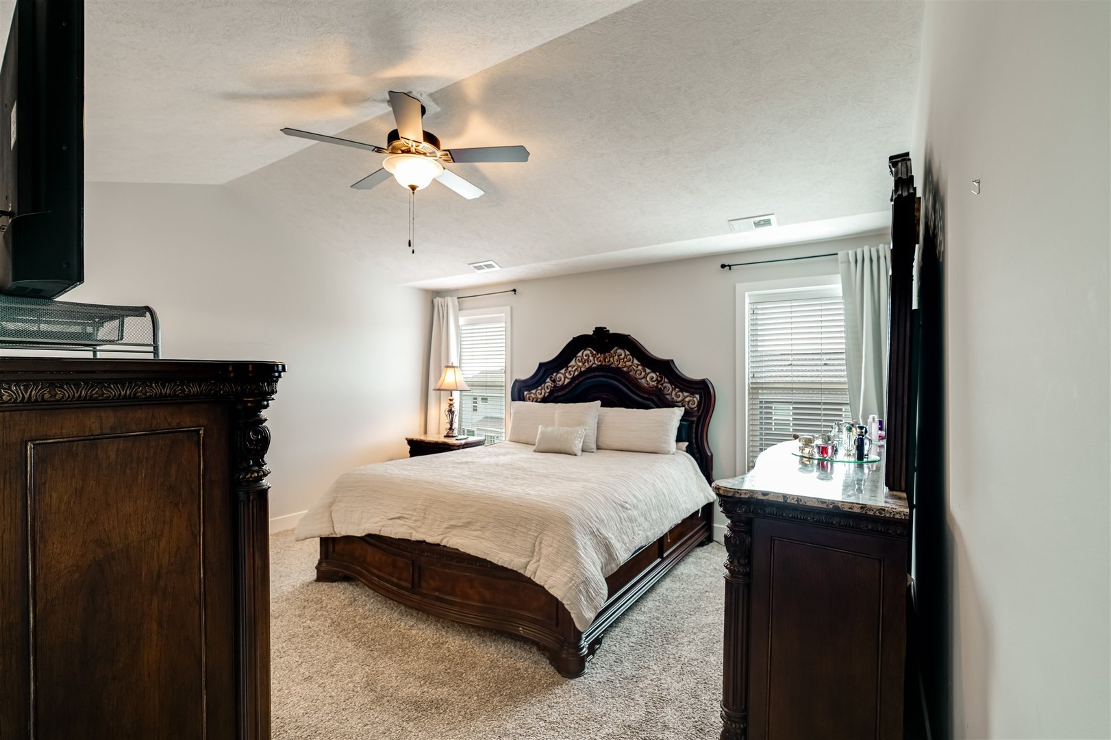 18 Red Maple Court Bloomington, IL 61705 - Photo 22 of 48 a bedroom with a bed and a chandelier