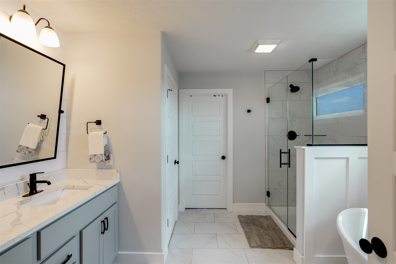 18 Red Maple Court Bloomington, IL 61705 - Photo 25 of 48 a bathroom with a sink a toilet and a mirror