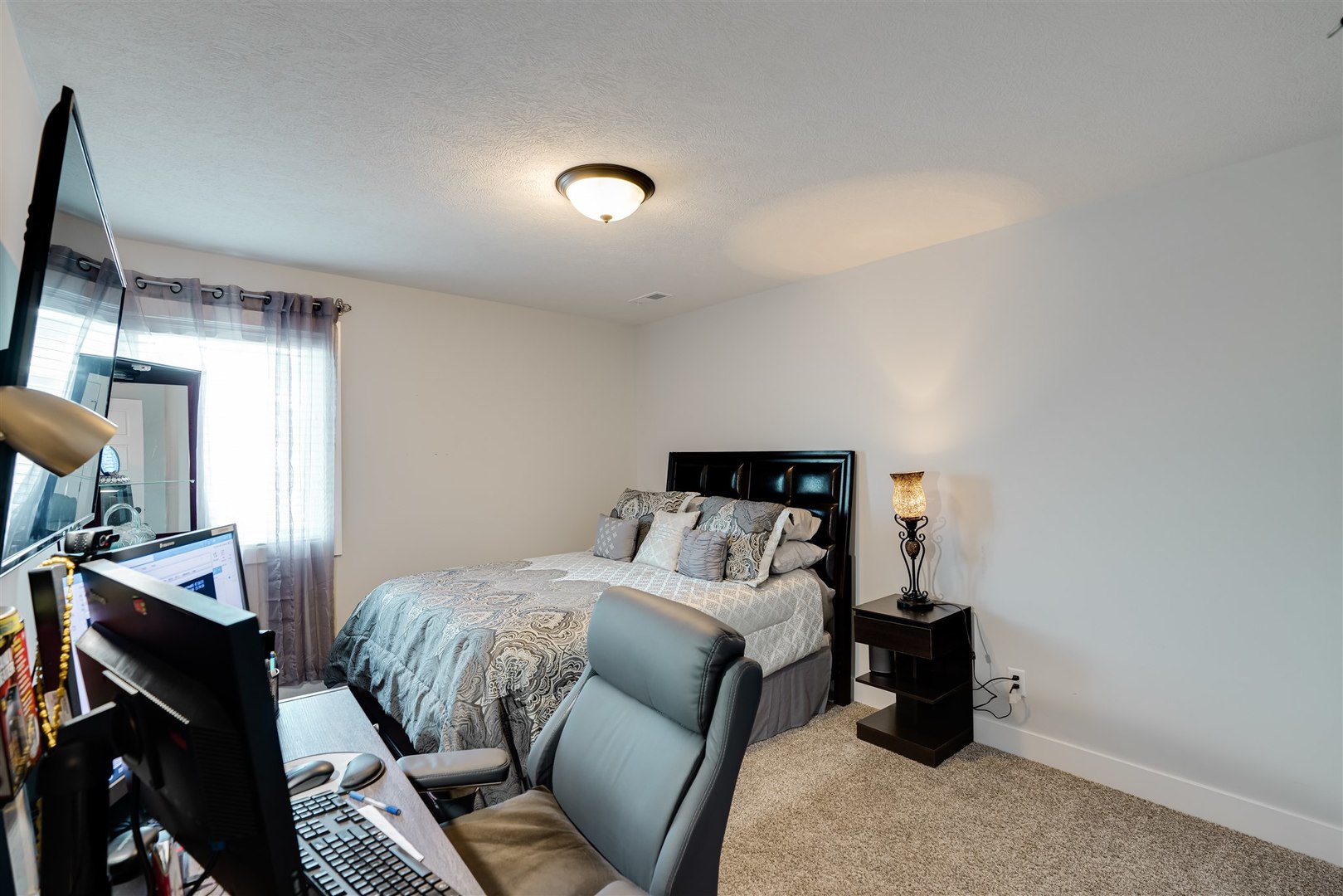 18 Red Maple Court Bloomington, IL 61705 - Photo 29 of 48 a bedroom with a bed and a mirror