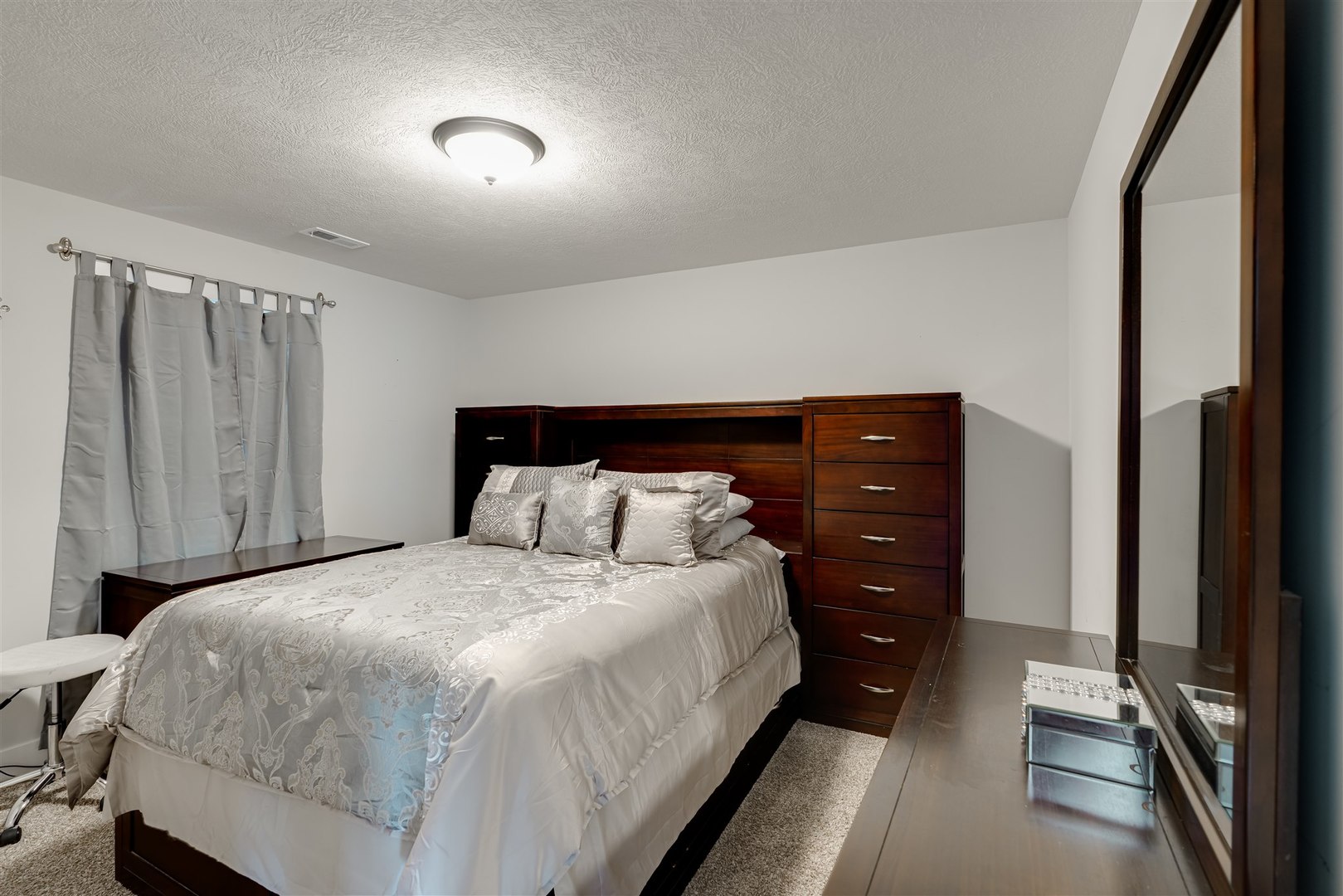18 Red Maple Court Bloomington, IL 61705 - Photo 31 of 48 a bedroom with a bed and a mirror