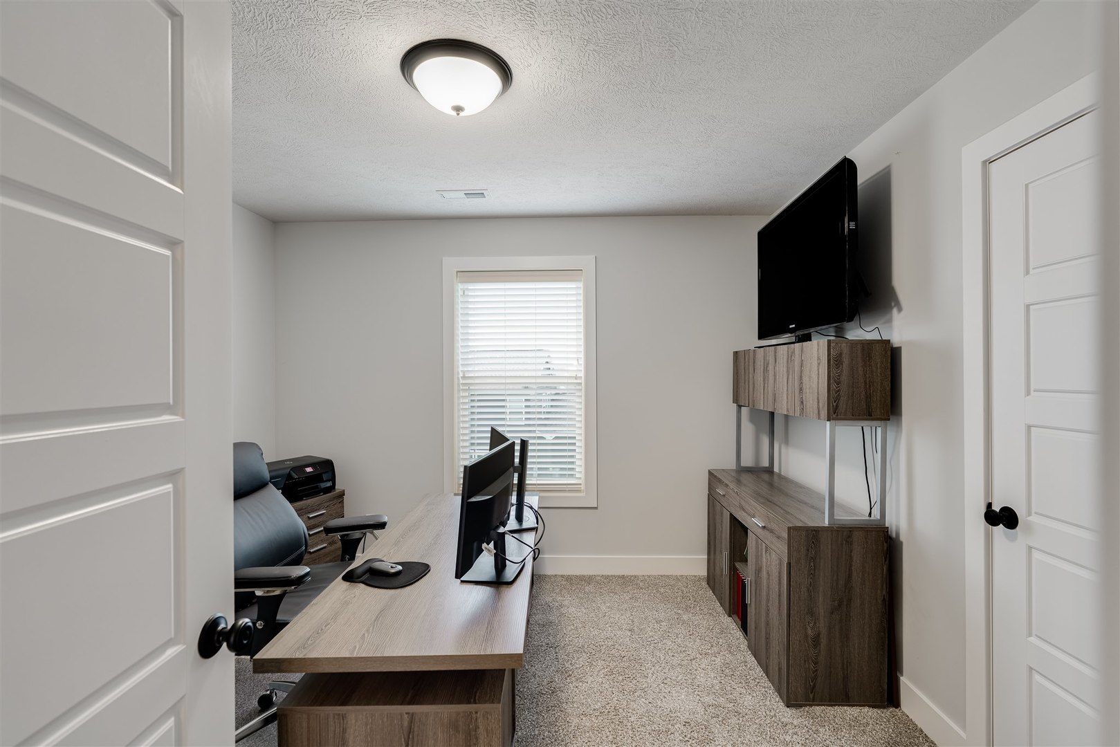 18 Red Maple Court Bloomington, IL 61705 - Photo 33 of 48 a view of a workspace with furniture and a window