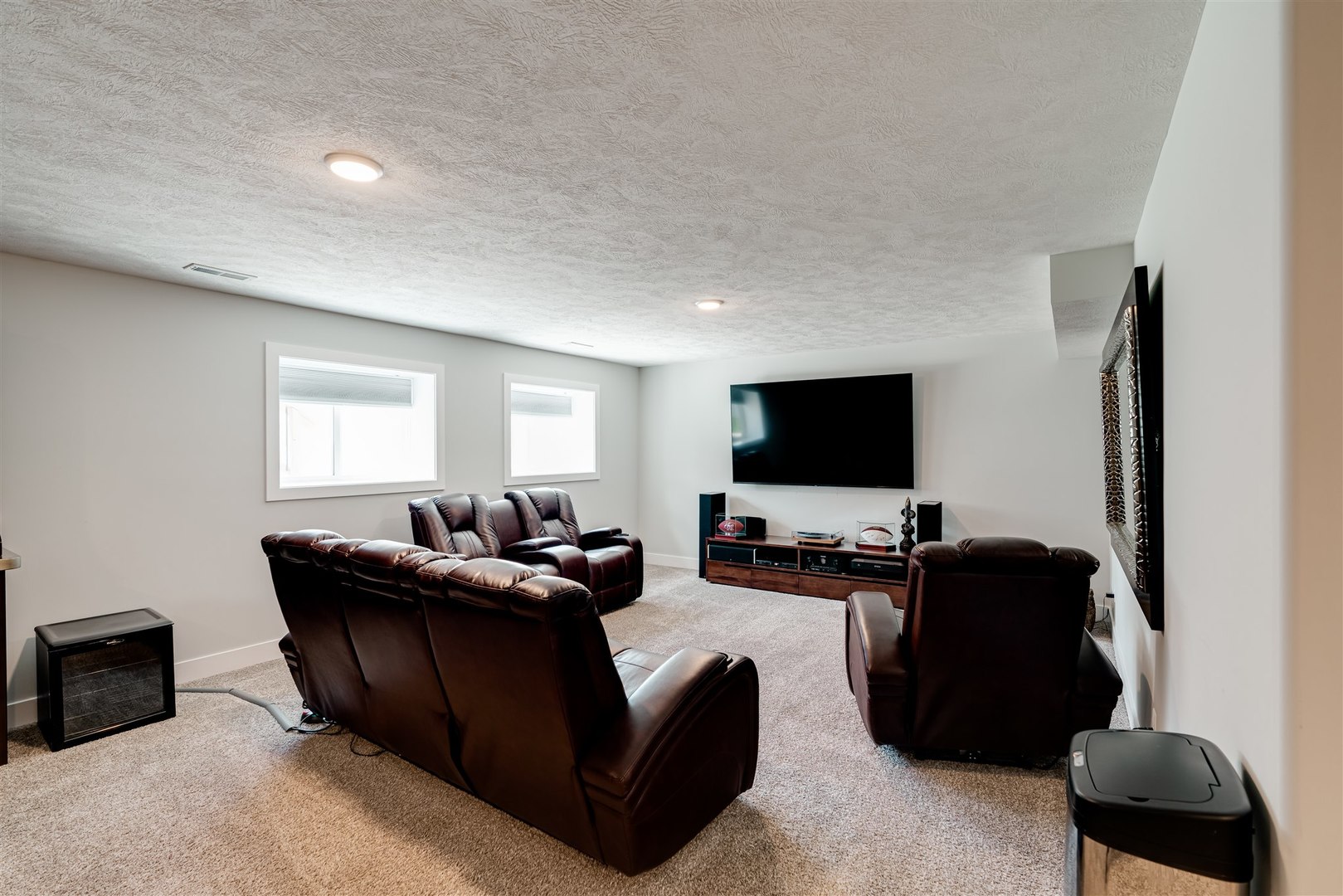 18 Red Maple Court Bloomington, IL 61705 - Photo 34 of 48 a living room with furniture and a flat screen tv