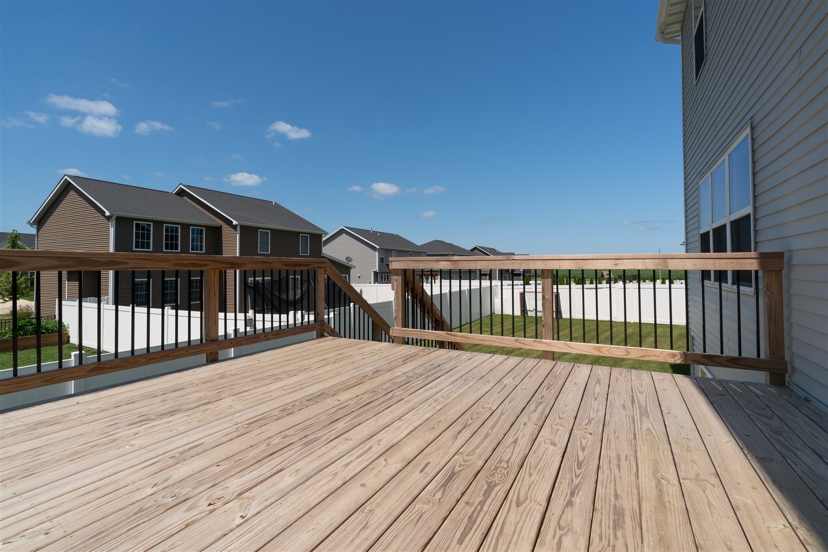 18 Red Maple Court Bloomington, IL 61705 - Photo 45 of 48 a view of a wooden deck with a yard