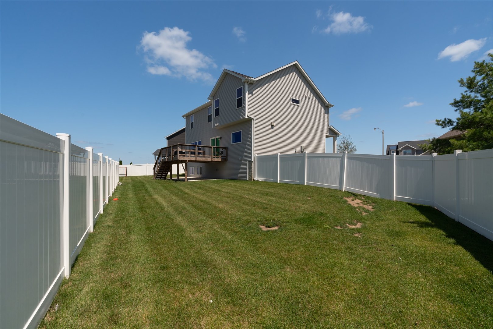 18 Red Maple Court Bloomington, IL 61705 - Photo 47 of 48 a view of an house with backyard and deck