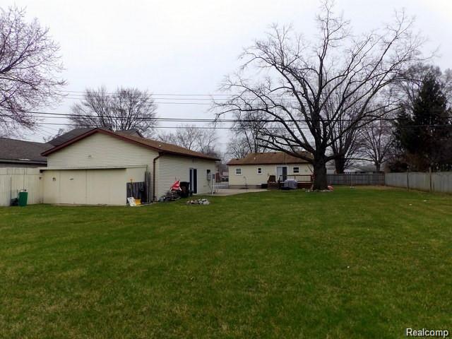 8108 Pardee Road Taylor, MI 48180 - Photo 6 of 58 06. THE HUGE (OVER ½ ACRE) PARK-LIKE (103X300) PRIVACY FENCED BACKYARD WITH SHADE TREES!