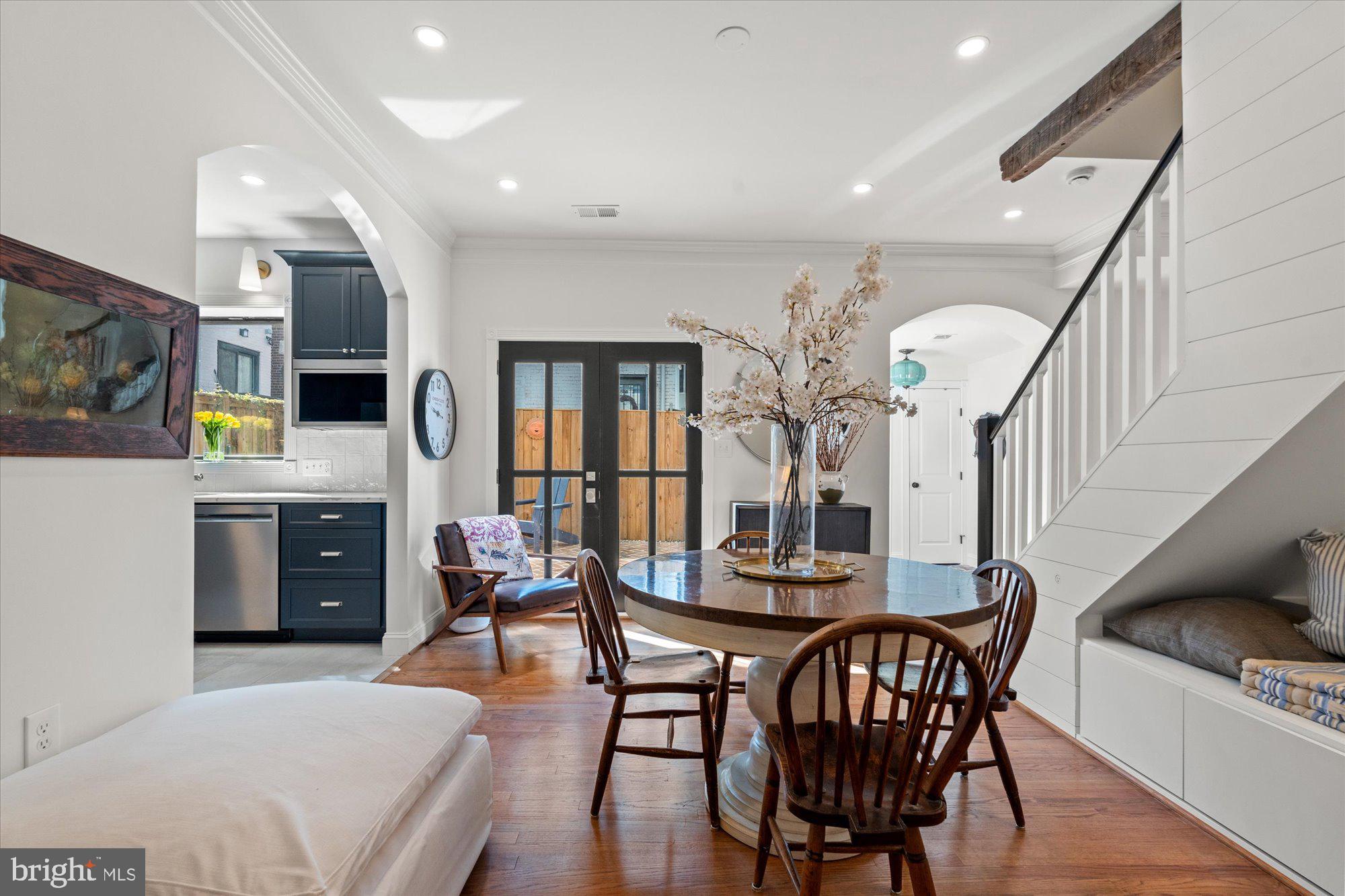 629 Pickford Place Northeast Washington, DC 20002 - Photo 17 of 41 a living room with furniture a flat screen tv and kitchen view