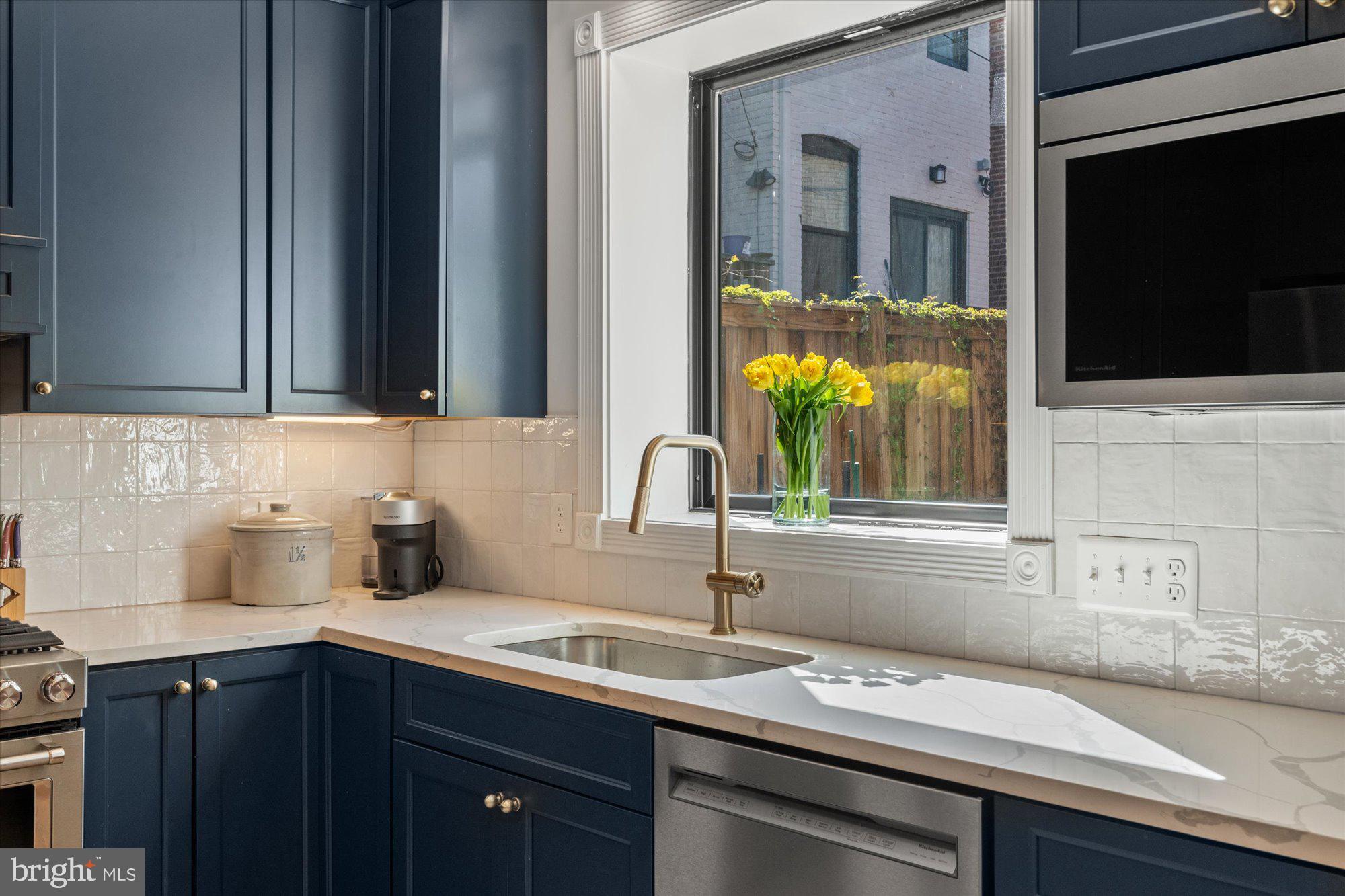 629 Pickford Place Northeast Washington, DC 20002 - Photo 20 of 41 a kitchen with a sink and cabinets