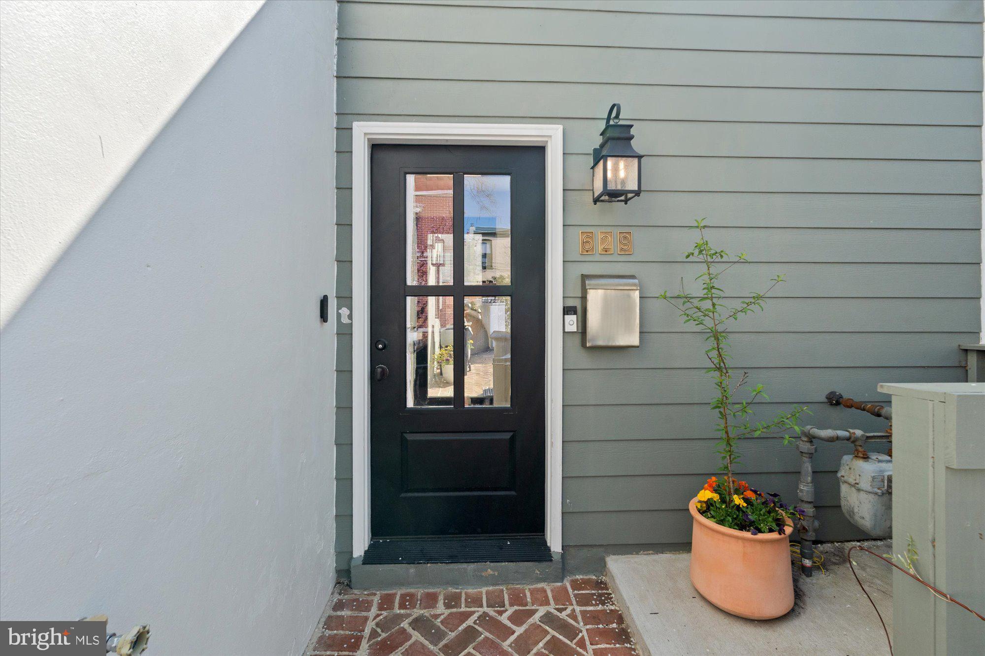 629 Pickford Place Northeast Washington, DC 20002 - Photo 2 of 41 a glass door with shower and window
