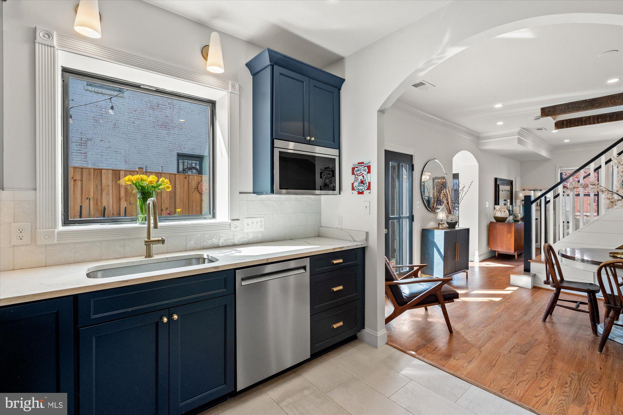 629 Pickford Place Northeast Washington, DC 20002 - Photo 21 of 41 a spacious bathroom with a double vanity sink and a large mirror