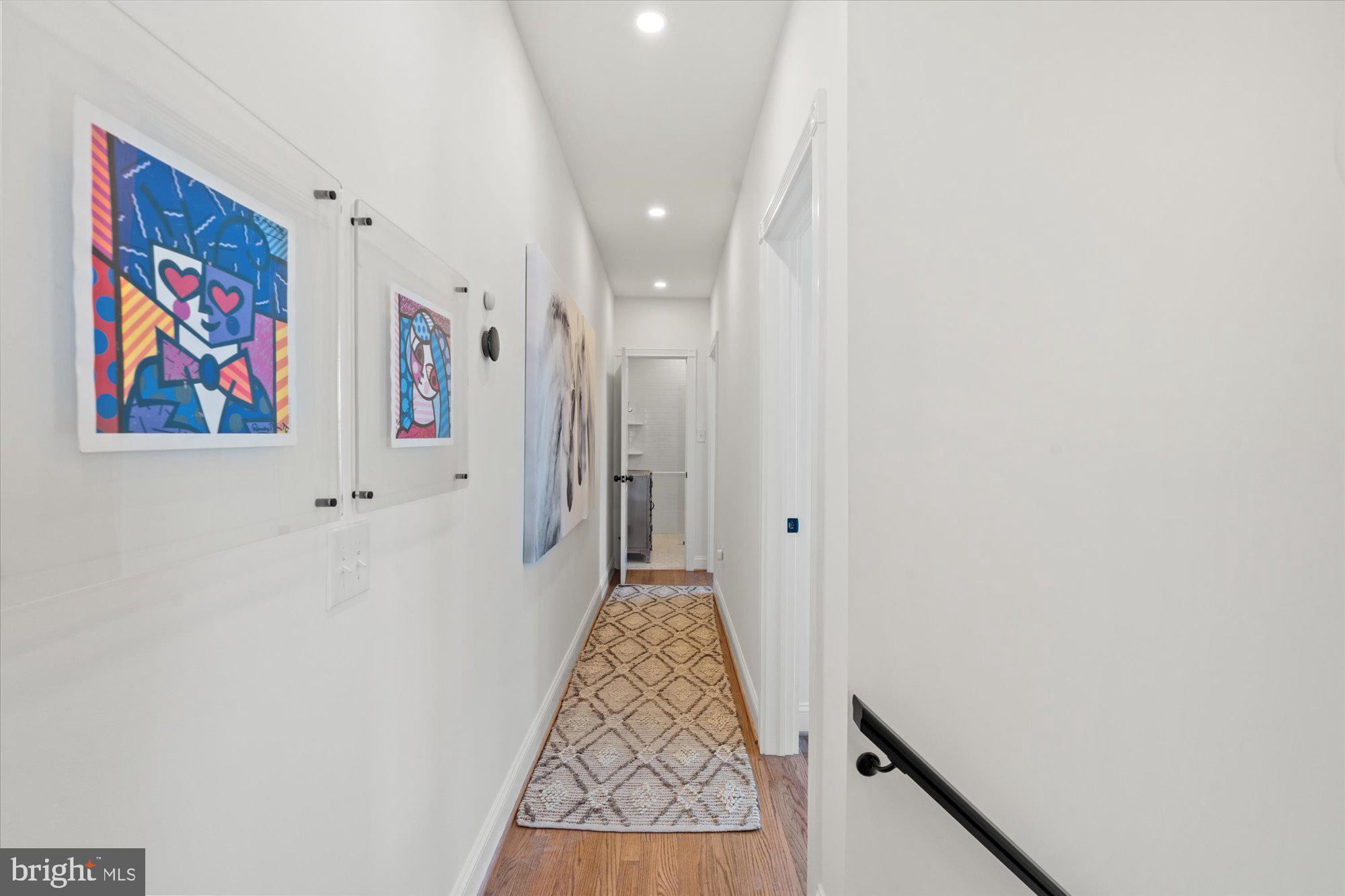 629 Pickford Place Northeast Washington, DC 20002 - Photo 24 of 41 a view of a hallway with paintings on the wall