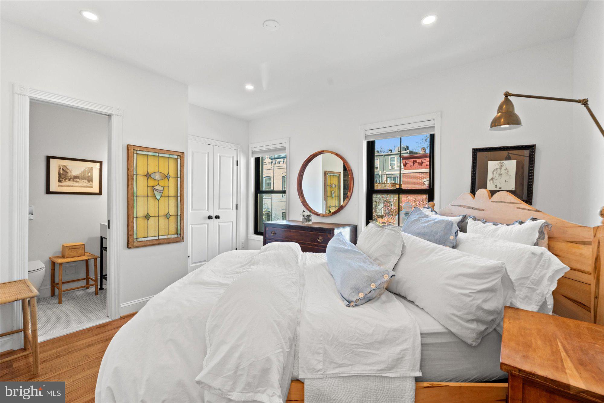 629 Pickford Place Northeast Washington, DC 20002 - Photo 25 of 41 a bed room with a bed a mirror and a table