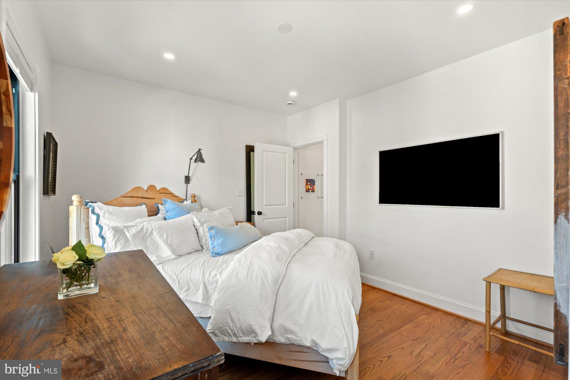 629 Pickford Place Northeast Washington, DC 20002 - Photo 26 of 41 a bedroom with a bed and a flat screen tv