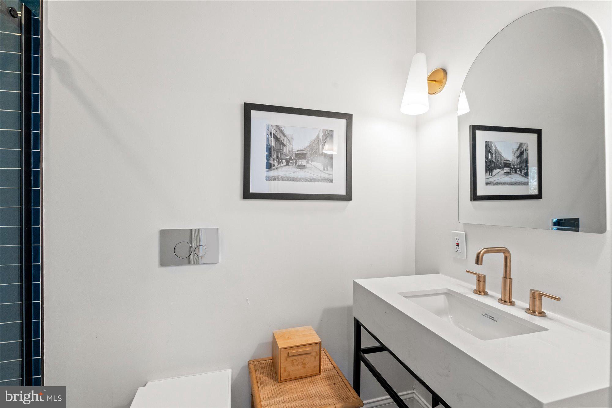 629 Pickford Place Northeast Washington, DC 20002 - Photo 29 of 41 a bathroom with a toilet a sink and mirror