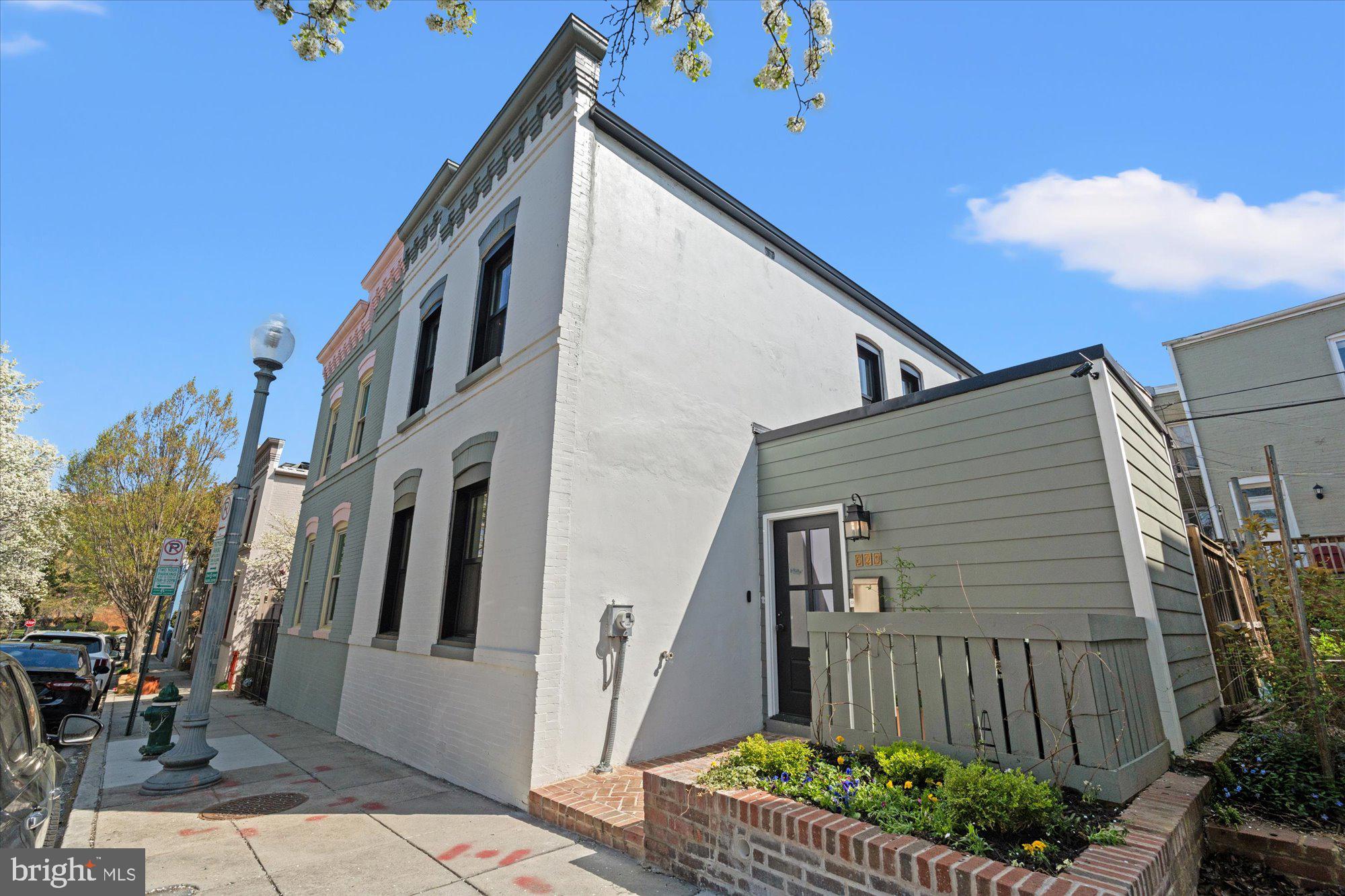 629 Pickford Place Northeast Washington, DC 20002 - Photo 3 of 41 a back view of a house with a yard
