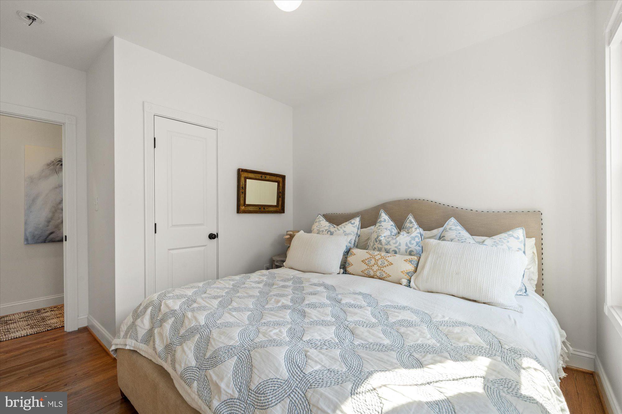 629 Pickford Place Northeast Washington, DC 20002 - Photo 31 of 41 a bedroom with a bed and a night stand