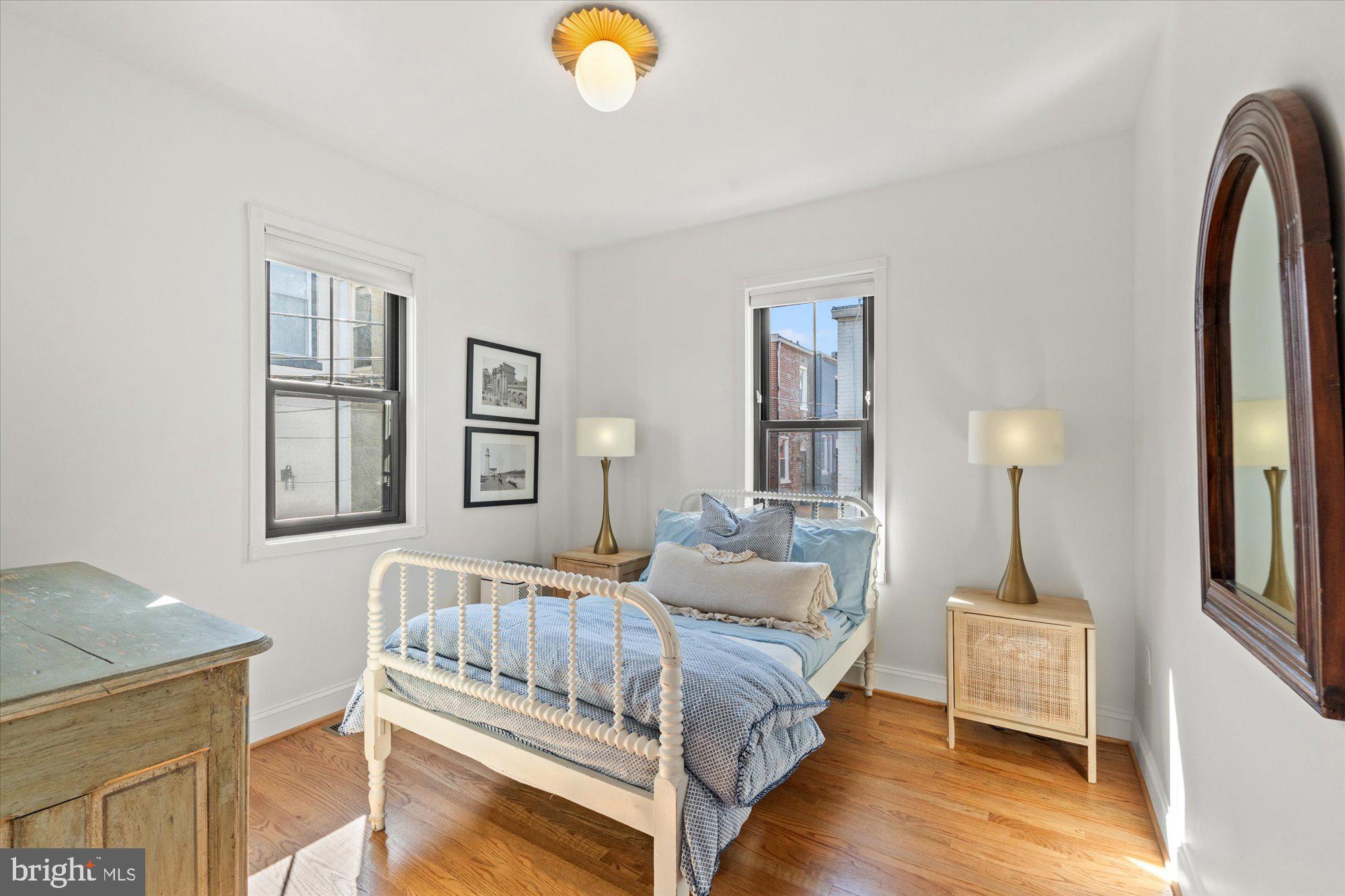 629 Pickford Place Northeast Washington, DC 20002 - Photo 33 of 41 a bedroom with a bed and wooden floor