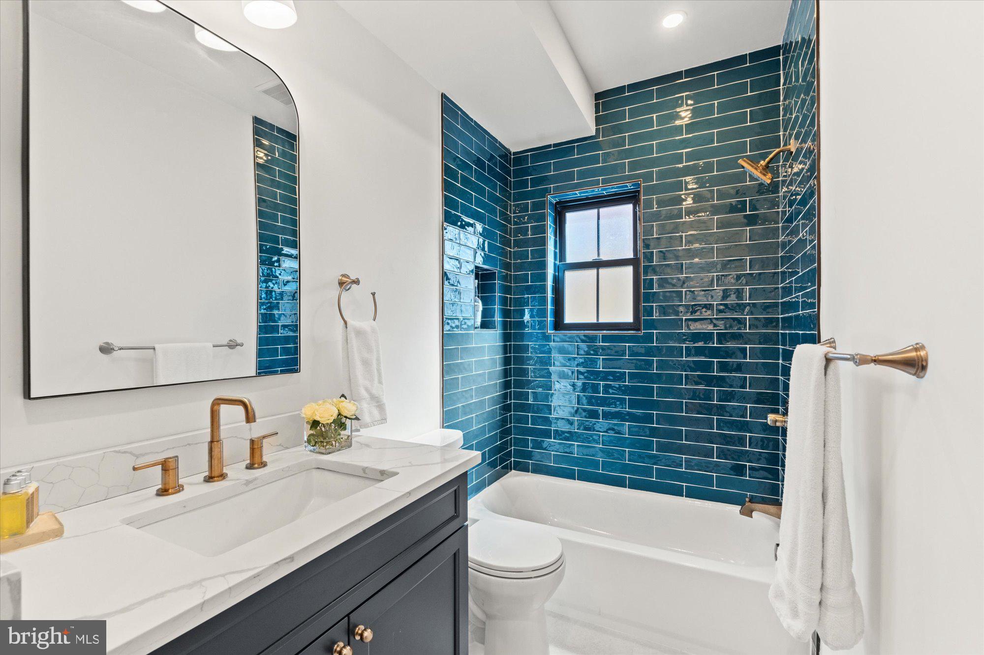 629 Pickford Place Northeast Washington, DC 20002 - Photo 35 of 41 a bathroom with a sink a toilet and shower
