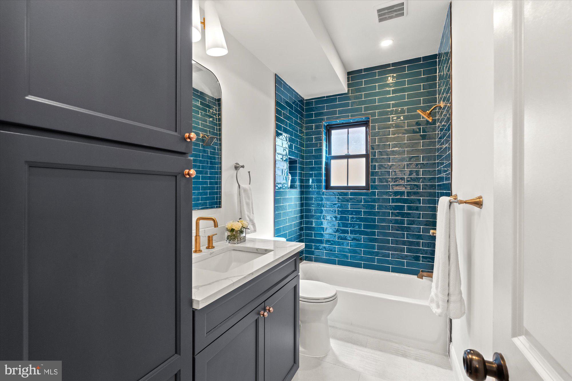 629 Pickford Place Northeast Washington, DC 20002 - Photo 36 of 41 a bathroom with a sink a bathtub and a shower