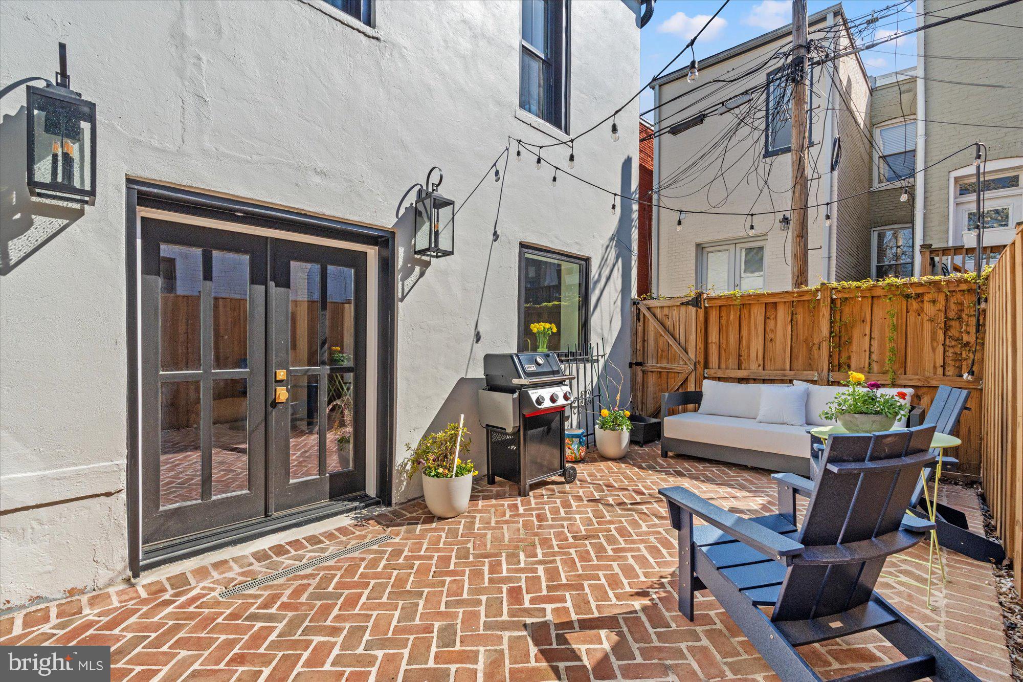 629 Pickford Place Northeast Washington, DC 20002 - Photo 39 of 41 a view of a patio with a table and chairs