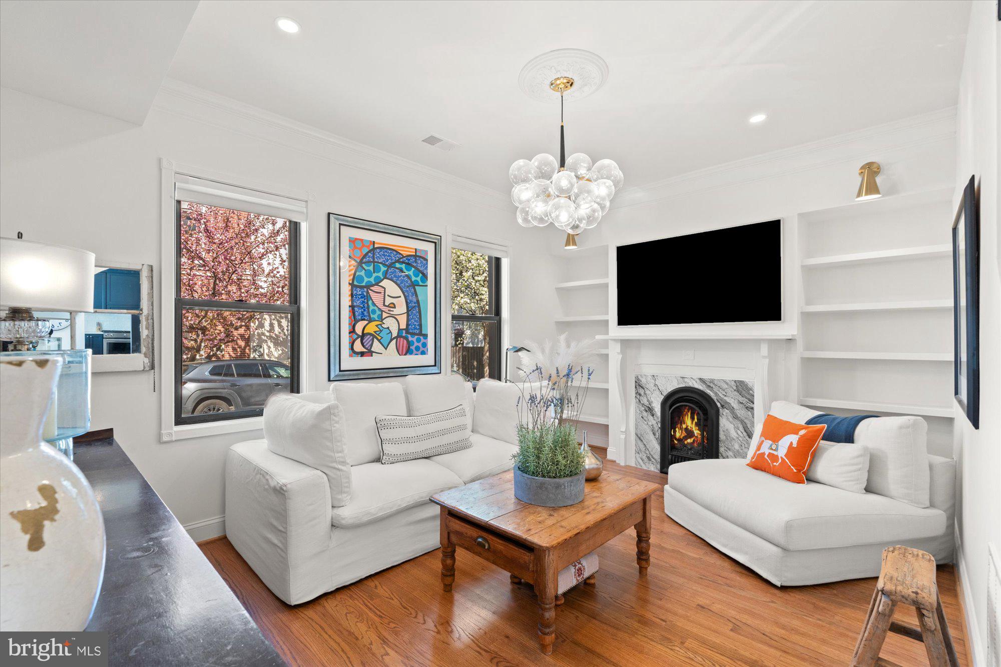 629 Pickford Place Northeast Washington, DC 20002 - Photo 10 of 41 a living room with furniture a fireplace and a flat screen tv